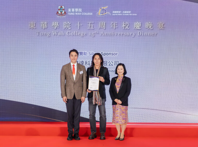 Our COO is receiving a Certificate of appreciation on stage from Tung Wah College.